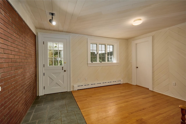 94 Cedar Ave, Poughkeepsie, NY 12603 - foyer with a baseboard radiator, brick wall, wooden ceiling, and wood finished floors
