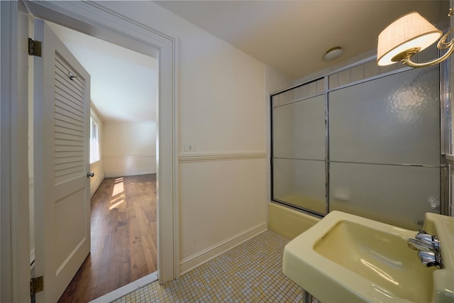 94 Cedar Ave, Poughkeepsie, NY 12603 - full bathroom featuring a sink, combined bath / shower with glass door, and baseboards