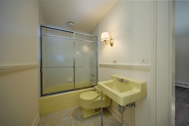 94 Cedar Ave, Poughkeepsie, NY 12603 - full bath featuring toilet, bath / shower combo with glass door, a baseboard heating unit, baseboards, and tile patterned flooring
