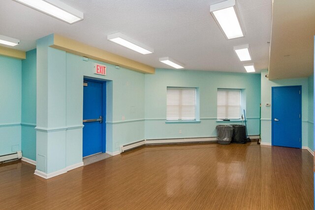 221 Bch 80th St Unit 2J, Rockaway Beach, NY 11693 - empty room featuring wood finished floors and baseboard heating