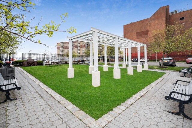 221 Bch 80th St Unit 2J, Rockaway Beach, NY 11693 - surrounding community with a pergola