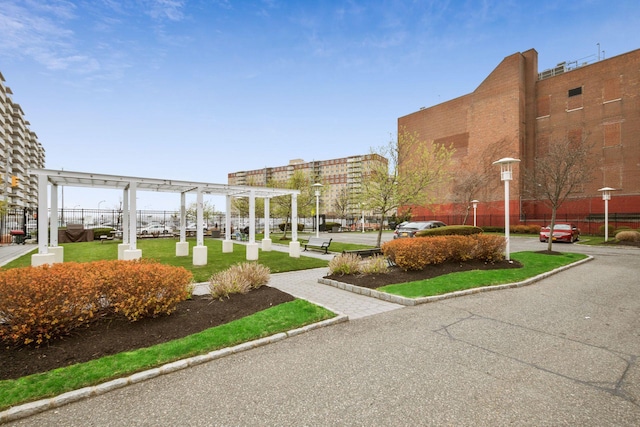 221 Bch 80th St Unit 2J, Rockaway Beach, NY 11693 - view of community featuring a pergola