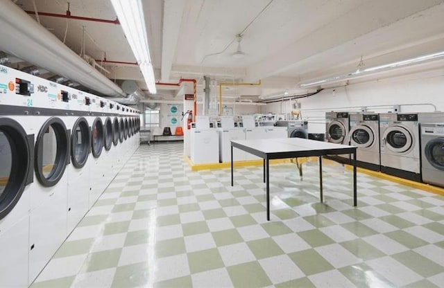 142-05 Roosevelt Ave Unit 517, Flushing, NY 11354 - shared laundry room with washing machine and dryer and tile patterned floors