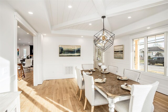 45 Mist Ln, Westbury, NY 11590 - dining area with healthy amount of natural light, light wood-type flooring, beam ceiling, recessed lighting, and a chandelier