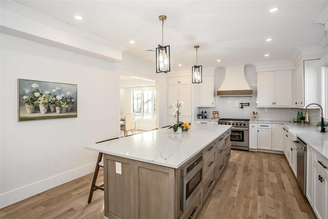 45 Mist Ln, Westbury, NY 11590 - kitchen with stainless steel appliances, custom range hood, a sink, light wood-type flooring, and decorative backsplash
