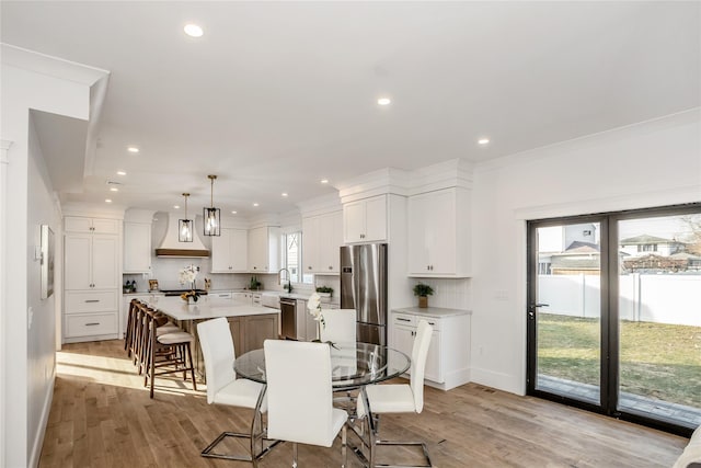 45 Mist Ln, Westbury, NY 11590 - dining area with plenty of natural light, light wood-style flooring, recessed lighting, and baseboards