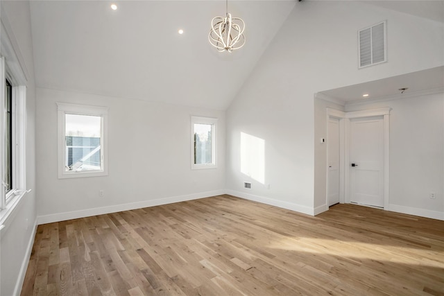 45 Mist Ln, Westbury, NY 11590 - unfurnished room featuring a chandelier, light wood-style floors, baseboards, high vaulted ceiling, and recessed lighting