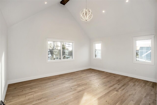 45 Mist Ln, Westbury, NY 11590 - unfurnished room featuring a chandelier, high vaulted ceiling, light wood-style flooring, baseboards, and recessed lighting