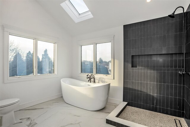 45 Mist Ln, Westbury, NY 11590 - full bath with marble look tile flooring, a tile shower, a freestanding bath, a skylight, and vaulted ceiling