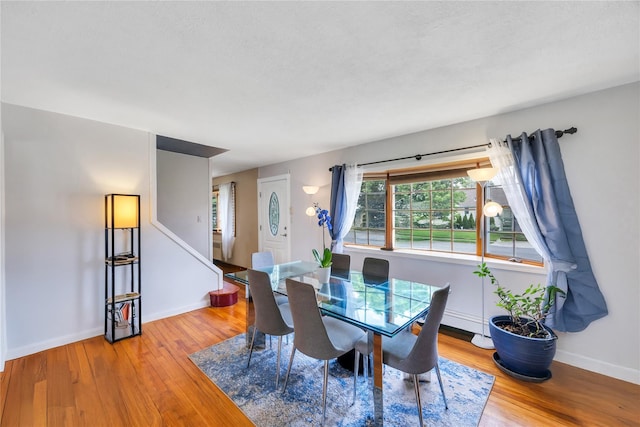 86 Woodbine Dr N, Hicksville, NY 11801 - dining room with wood finished floors and stairway