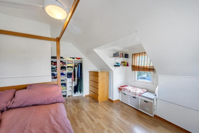 86 Woodbine Dr N, Hicksville, NY 11801 - bedroom featuring light wood-style flooring, lofted ceiling, and a closet