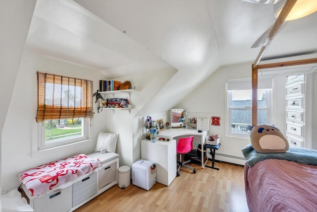 86 Woodbine Dr N, Hicksville, NY 11801 - bedroom with light wood-style flooring, lofted ceiling, and a baseboard heating unit