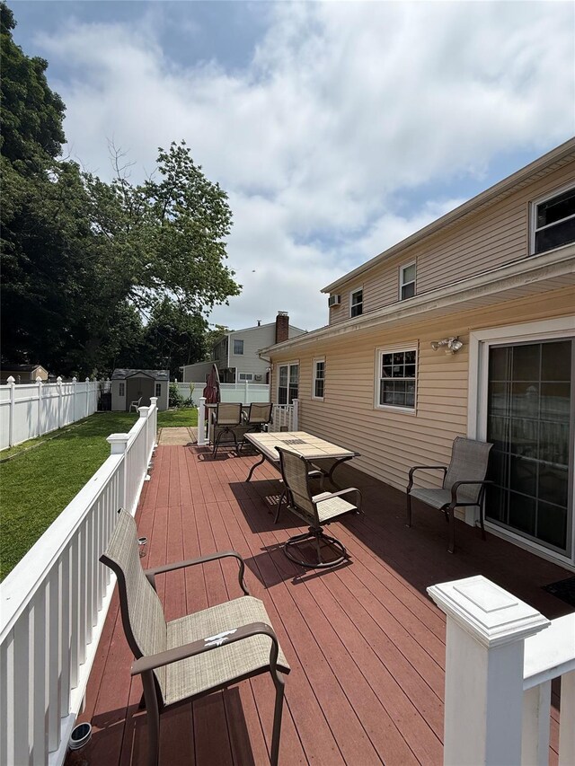 7 Ronald Ave, Hicksville, NY 11801 - deck with outdoor dining space and a storage shed