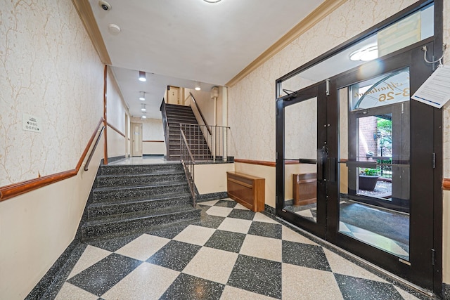 103-26 68th Ave Unit 2E, Forest Hills, NY 11375 - stairway with french doors, baseboards, tile patterned floors, ornamental molding, and a textured wall