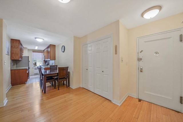 103-26 68th Ave Unit 2E, Forest Hills, NY 11375 - entryway featuring light wood-style floors and baseboards