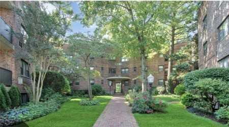50 Brompton Unit 3K, Great Neck, NY 11021 - view of community with a lawn