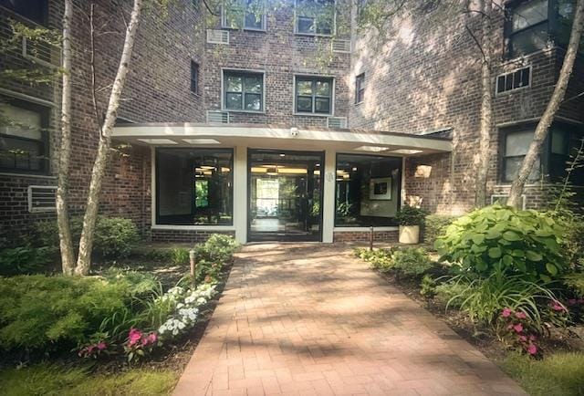 50 Brompton Unit 3K, Great Neck, NY 11021 - view of exterior entry featuring brick siding