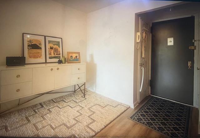 50 Brompton Unit 3K, Great Neck, NY 11021 - foyer with wood finished floors and baseboards