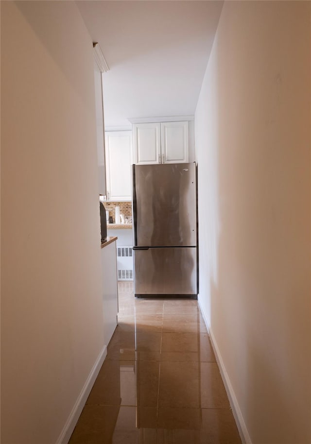 50 Brompton Unit 3K, Great Neck, NY 11021 - hall featuring light tile patterned floors and baseboards