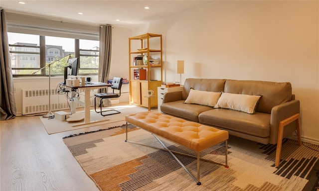 50 Brompton Unit 3K, Great Neck, NY 11021 - living area with radiator heating unit, wood finished floors, and recessed lighting