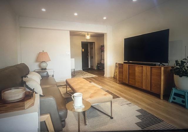 50 Brompton Unit 3K, Great Neck, NY 11021 - living area featuring light wood-type flooring, recessed lighting, and baseboards