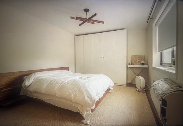 50 Brompton Unit 3K, Great Neck, NY 11021 - bedroom featuring a closet and a ceiling fan