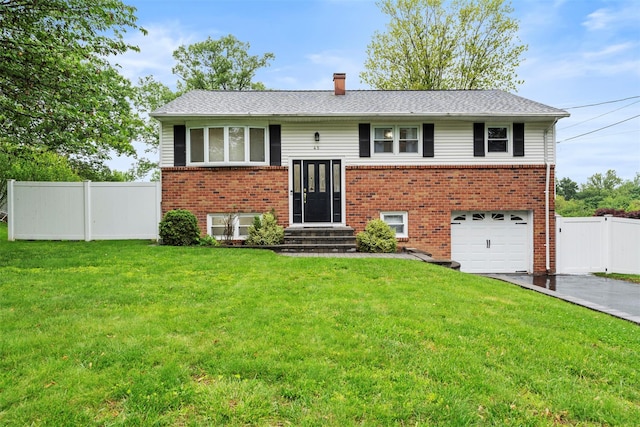 45 Maple Dr, Stony Point, NY 10980 - raised ranch with driveway, a garage, brick siding, and a chimney