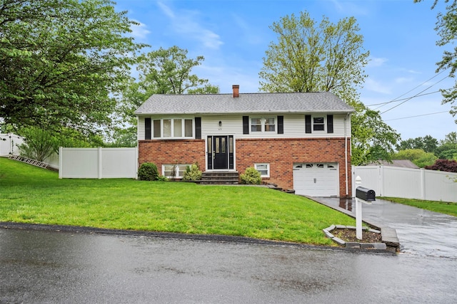45 Maple Dr, Stony Point, NY 10980 - split foyer home with driveway, brick siding, a garage, and a chimney