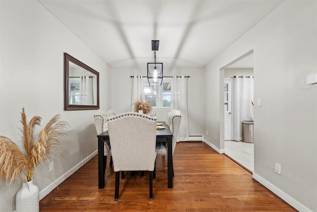 45 Maple Dr, Stony Point, NY 10980 - dining area with wood finished floors, baseboards, and a baseboard heating unit