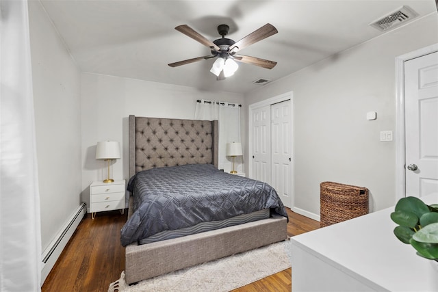 45 Maple Dr, Stony Point, NY 10980 - bedroom featuring baseboard heating, a closet, wood finished floors, a ceiling fan, and baseboards