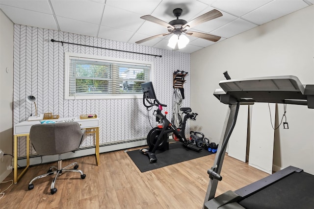 45 Maple Dr, Stony Point, NY 10980 - exercise room featuring wallpapered walls, ceiling fan, wood finished floors, an accent wall, and a drop ceiling