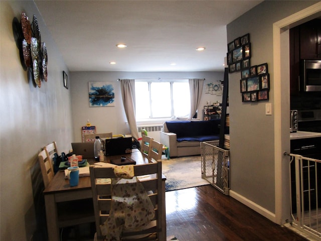 88-25 155th Unit 2M, Howard Beach, NY 11414 - dining space featuring wood finished floors, recessed lighting, baseboards, a desk, and radiator