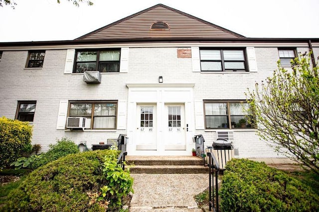 67-89 136th St Unit A, Kew Garden Hills, NY 11367 - view of front of property with brick siding and cooling unit
