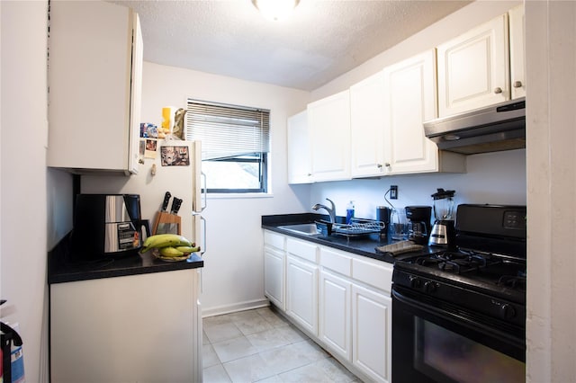 67-89 136th St Unit A, Kew Garden Hills, NY 11367 - kitchen featuring black range with gas stovetop, under cabinet range hood, a sink, dark countertops, and white cabinetry