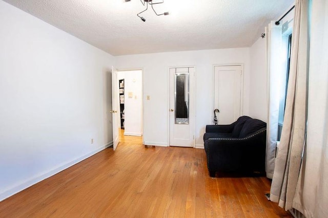 67-89 136th St Unit A, Kew Garden Hills, NY 11367 - living area featuring wood finished floors and baseboards