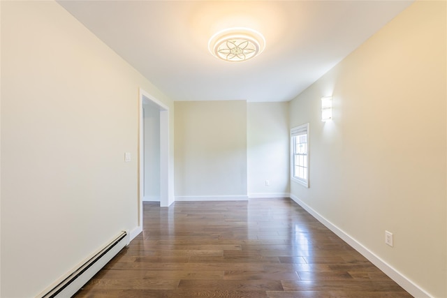 29 Underhill Ave, Syosset, NY 11791 - unfurnished room with a baseboard heating unit, dark wood-style flooring, and baseboards