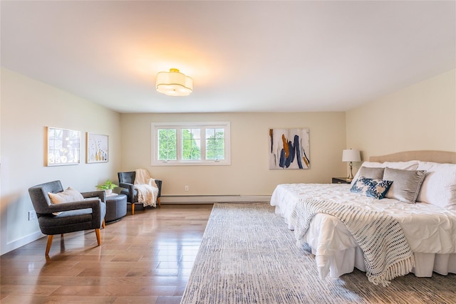 29 Underhill Ave, Syosset, NY 11791 - bedroom with wood finished floors and a baseboard radiator