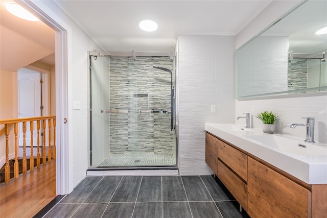 29 Underhill Ave, Syosset, NY 11791 - bathroom featuring a shower stall, double vanity, wood finished floors, and crown molding