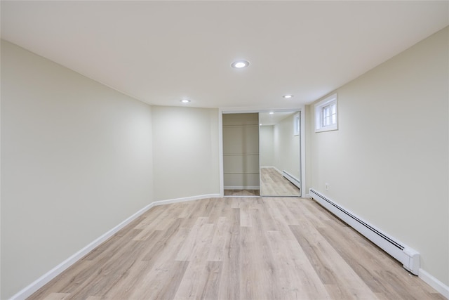 29 Underhill Ave, Syosset, NY 11791 - unfurnished bedroom with a baseboard radiator, light wood-style floors, a closet, baseboards, and recessed lighting