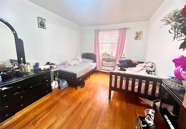 40-70 Case St, Elmhurst, NY 11373 - bedroom with wood finished floors and a wall mounted air conditioner