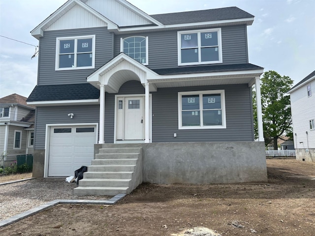 1116 Washington Pl, Baldwin Harbor, NY 11510 - view of front facade with an attached garage, a shingled roof, and dirt driveway