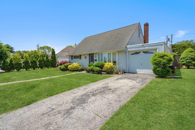 315 Fern Pl, Bethpage, NY 11714 - view of front of property featuring an attached garage, driveway, a chimney, a front yard, and roof with shingles