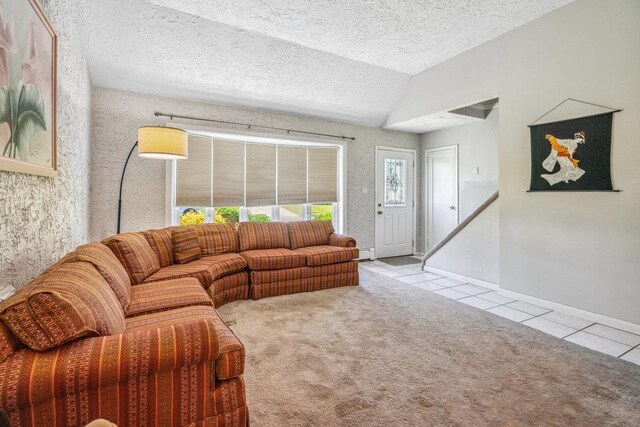 315 Fern Pl, Bethpage, NY 11714 - living area with tile patterned floors, lofted ceiling, a textured ceiling, carpet floors, and baseboards