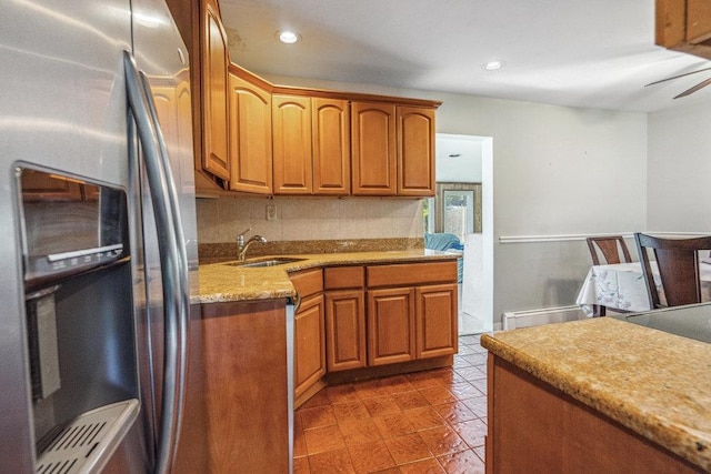315 Fern Pl, Bethpage, NY 11714 - kitchen with stainless steel fridge, a sink, brown cabinets, recessed lighting, and light stone counters