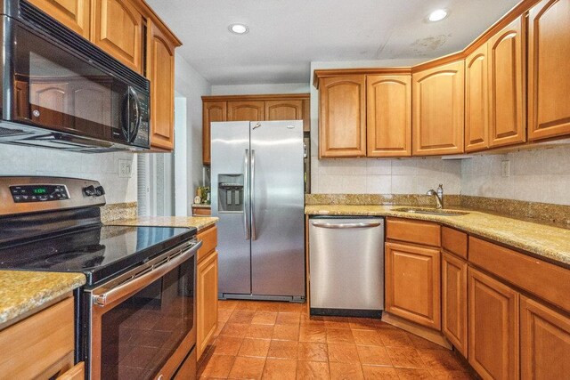 315 Fern Pl, Bethpage, NY 11714 - kitchen with stainless steel appliances, a sink, backsplash, recessed lighting, and brown cabinetry