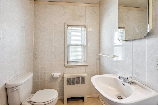 315 Fern Pl, Bethpage, NY 11714 - bathroom featuring radiator, toilet, tile walls, and a sink