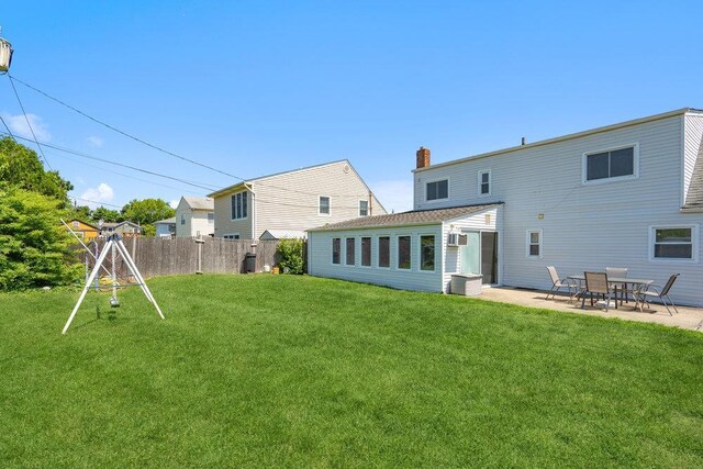 315 Fern Pl, Bethpage, NY 11714 - rear view of house with a chimney and a patio area