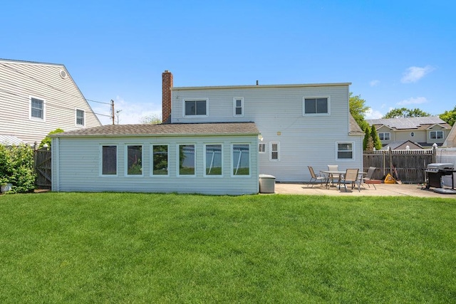 315 Fern Pl, Bethpage, NY 11714 - rear view of house featuring a chimney and a patio area