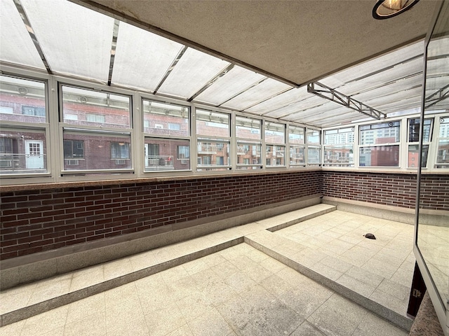 41-42 College Point Blvd Unit 3E, Flushing, NY 11355 - unfurnished sunroom with brick wall