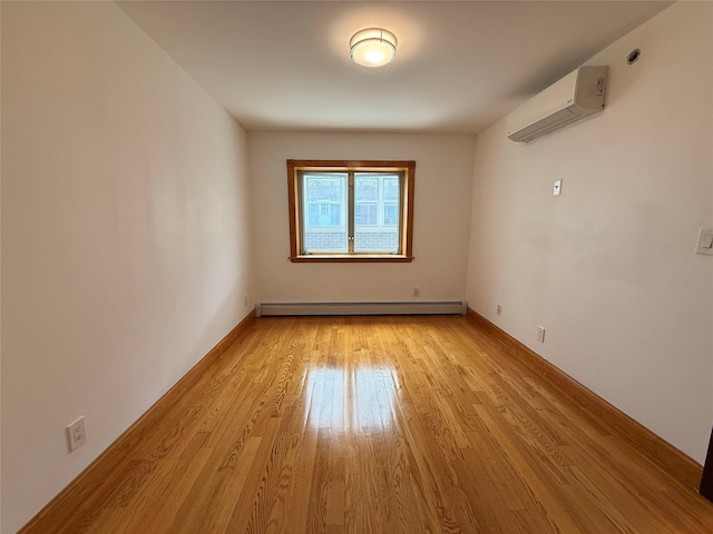 41-42 College Point Blvd Unit 3E, Flushing, NY 11355 - unfurnished room featuring a wall unit AC, baseboard heating, and light wood-style flooring